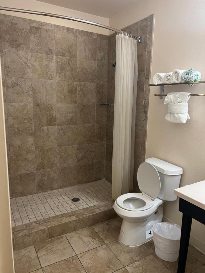 King Suite with Two King Beds and Sofa Bed at Sunchase Inn & Suites