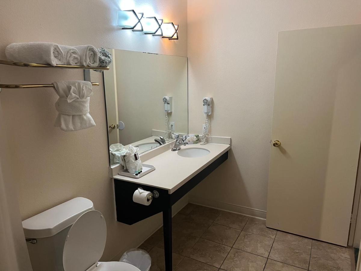King Suite with Two King Beds and Sofa Bed at Sunchase Inn & Suites