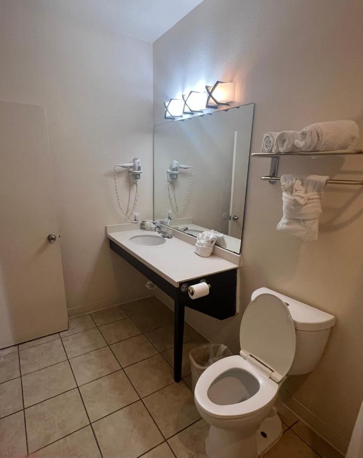 Queen Suite with Two Queen Beds and Sofa Bed at Sunchase Inn & Suites