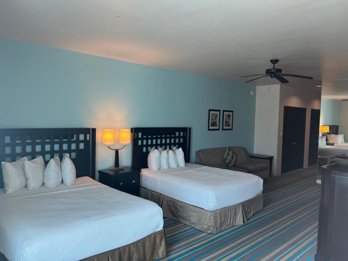 Queen Suite with Two Queen Beds and Sofa Bed at Sunchase Inn & Suites