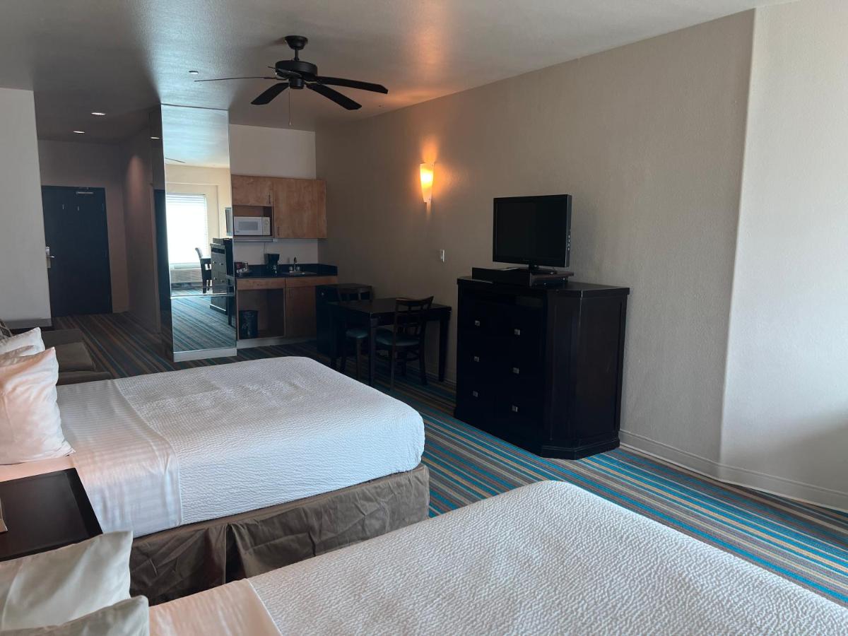 Queen Suite with Two Queen Beds and Sofa Bed at Sunchase Inn & Suites