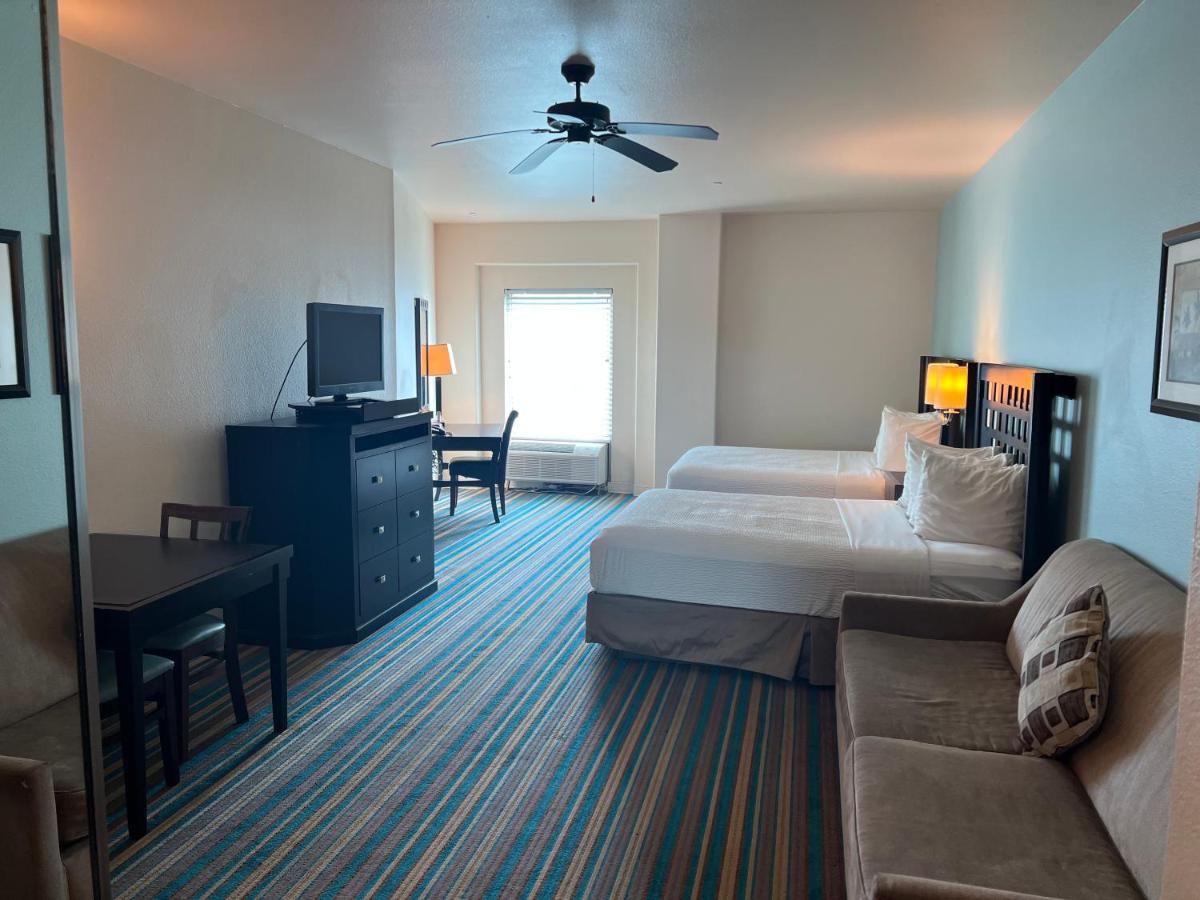 Queen Suite with Two Queen Beds and Sofa Bed at Sunchase Inn & Suites