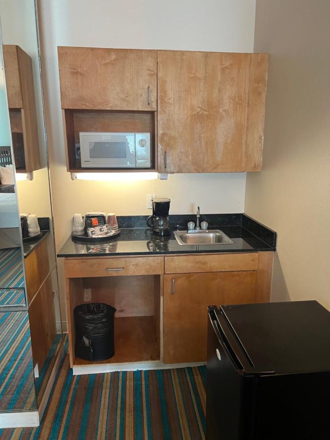 Queen Suite with Two Queen Beds and Sofa Bed at Sunchase Inn & Suites