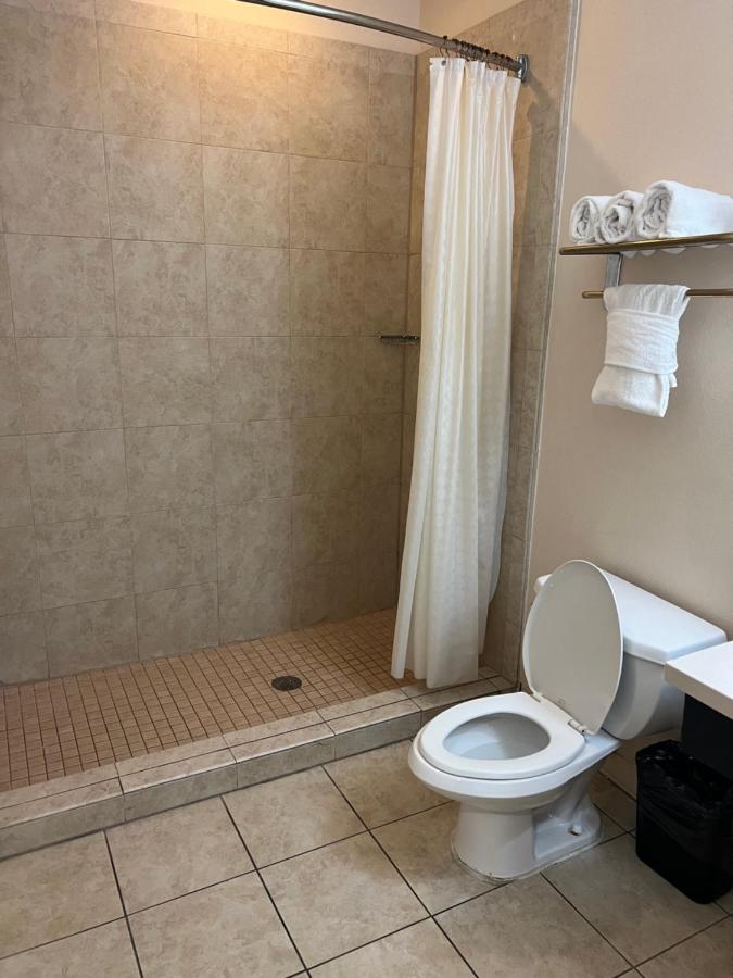 Queen Suite with Two Queen Beds and Sofa Bed at Sunchase Inn & Suites