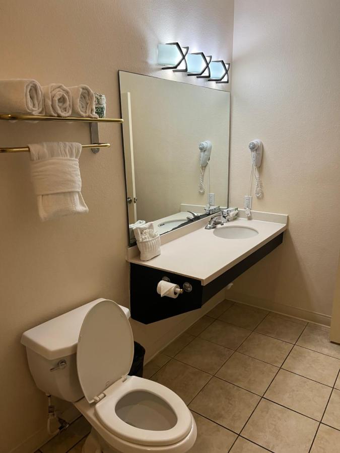 Queen Suite with Two Queen Beds and Sofa Bed at Sunchase Inn & Suites
