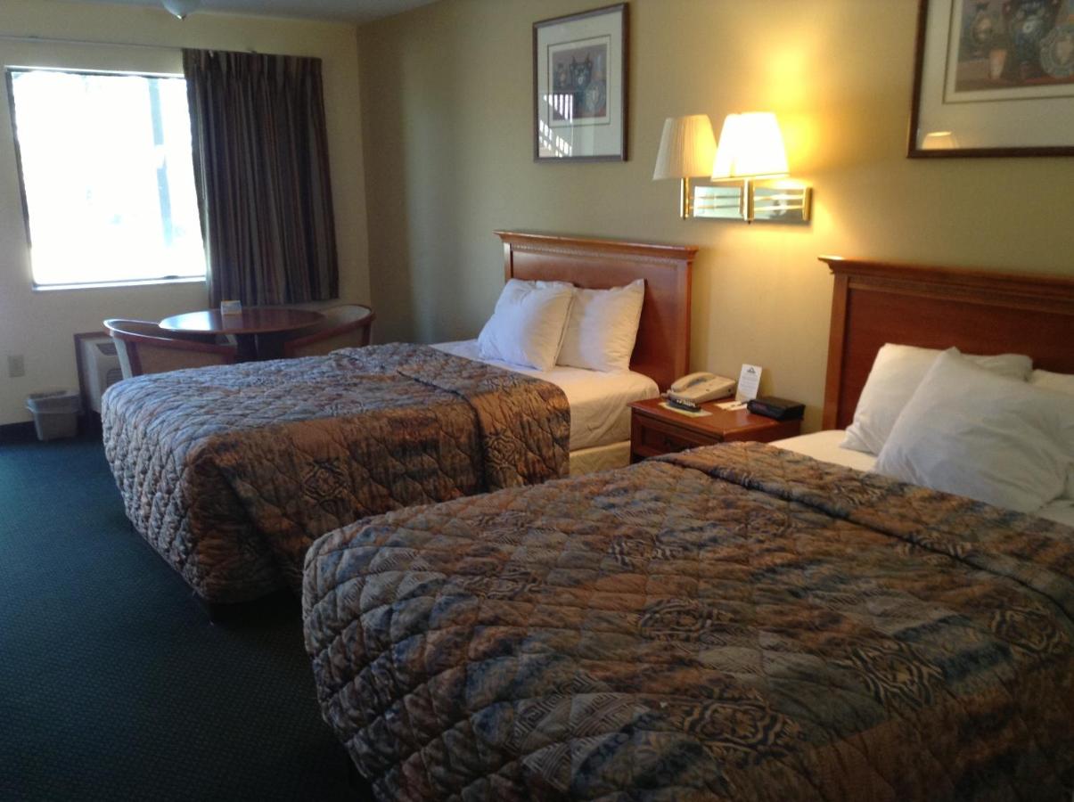 Queen Room with Two Queen Beds - Smoking at Days Inn & Suites by Wyndham Tucker/Northlake