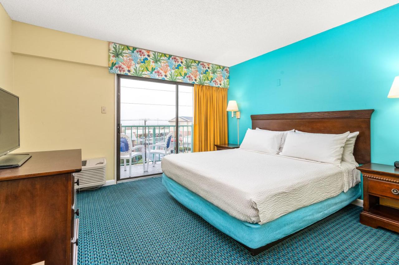King Suite with Balcony at Cayman Suites Hotel
