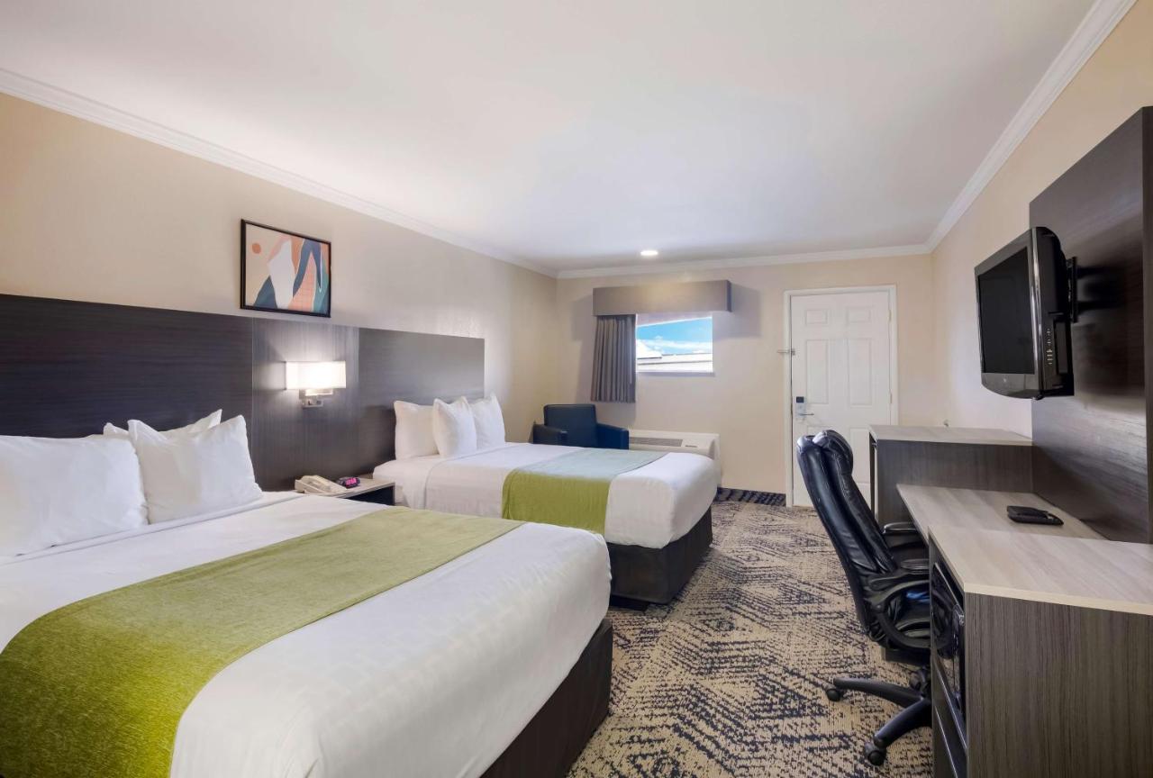 Queen Room with Two Queen Beds at SureStay Hotel by Best Western Rockdale