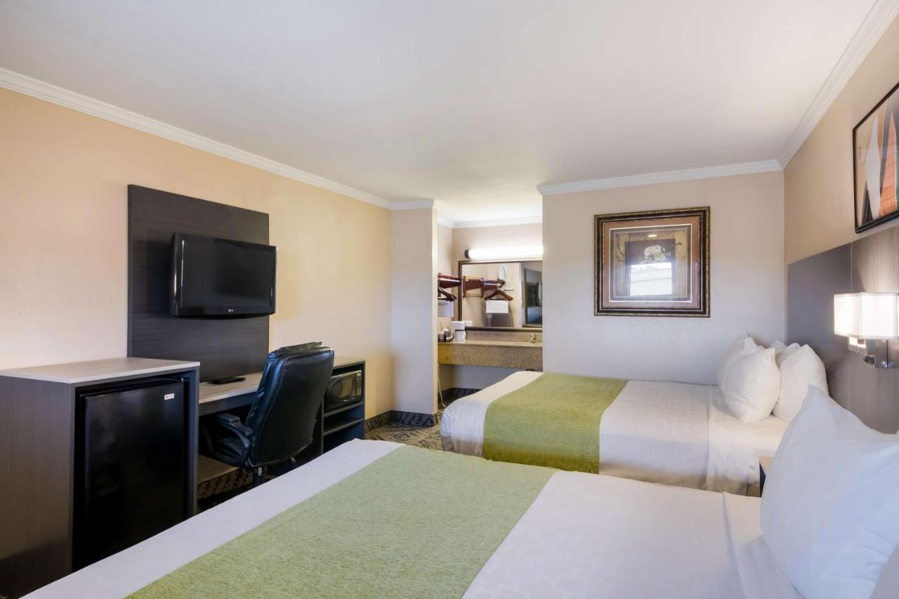 Queen Room with Two Queen Beds at SureStay Hotel by Best Western Rockdale