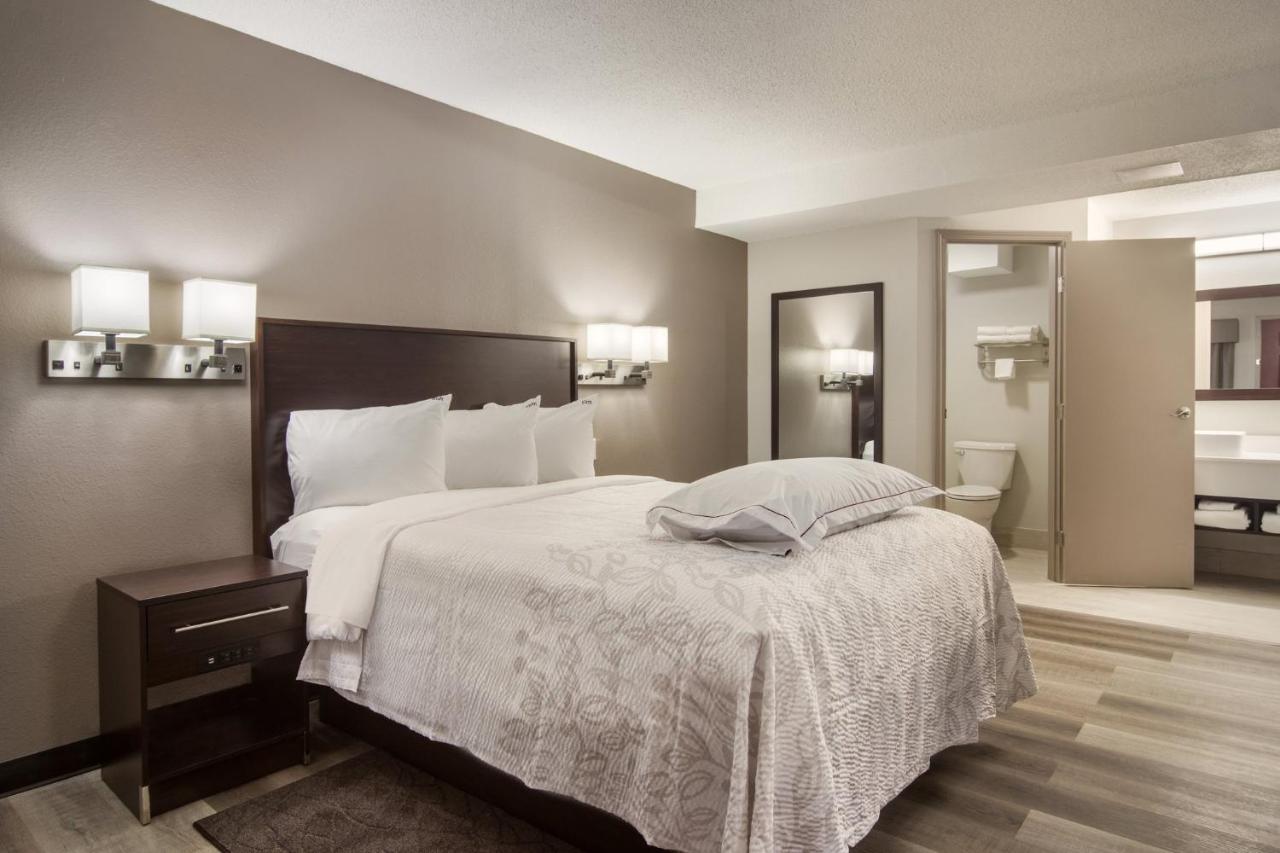 Premium Suite with Three Queen Beds with Kitchenette Smoke Free (Upgraded Bedding and Snack Box) at Red Roof Inn PLUS+ & Suites Erie