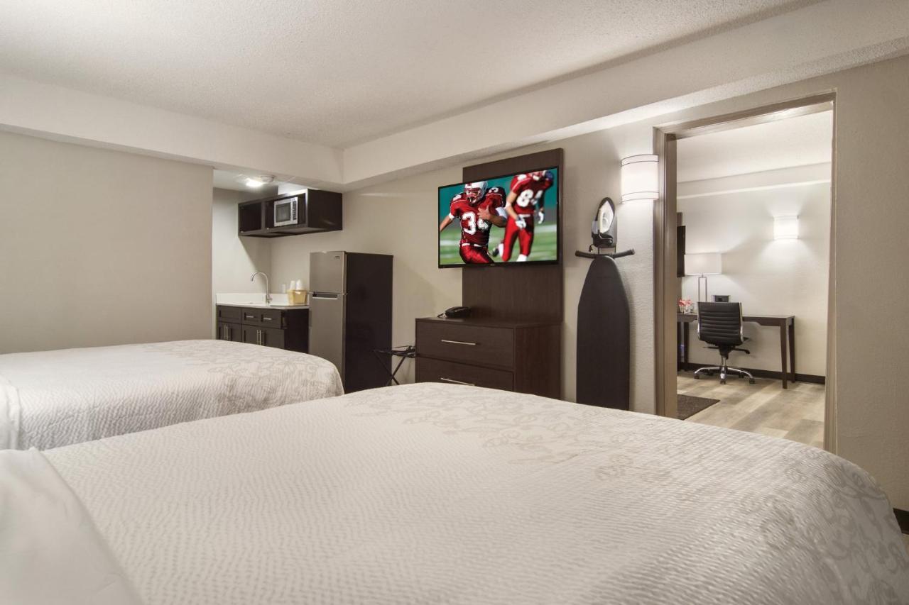 Suite with Three Queen Beds with Kitchenette Smoke Free at Red Roof Inn PLUS+ & Suites Erie