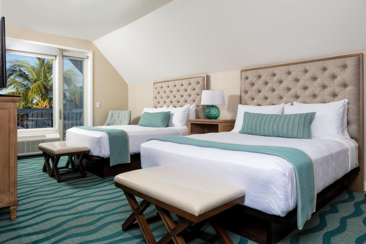 Two Bedroom Pool View Suite, King and Two Queen Beds at Sunset Key Cottages