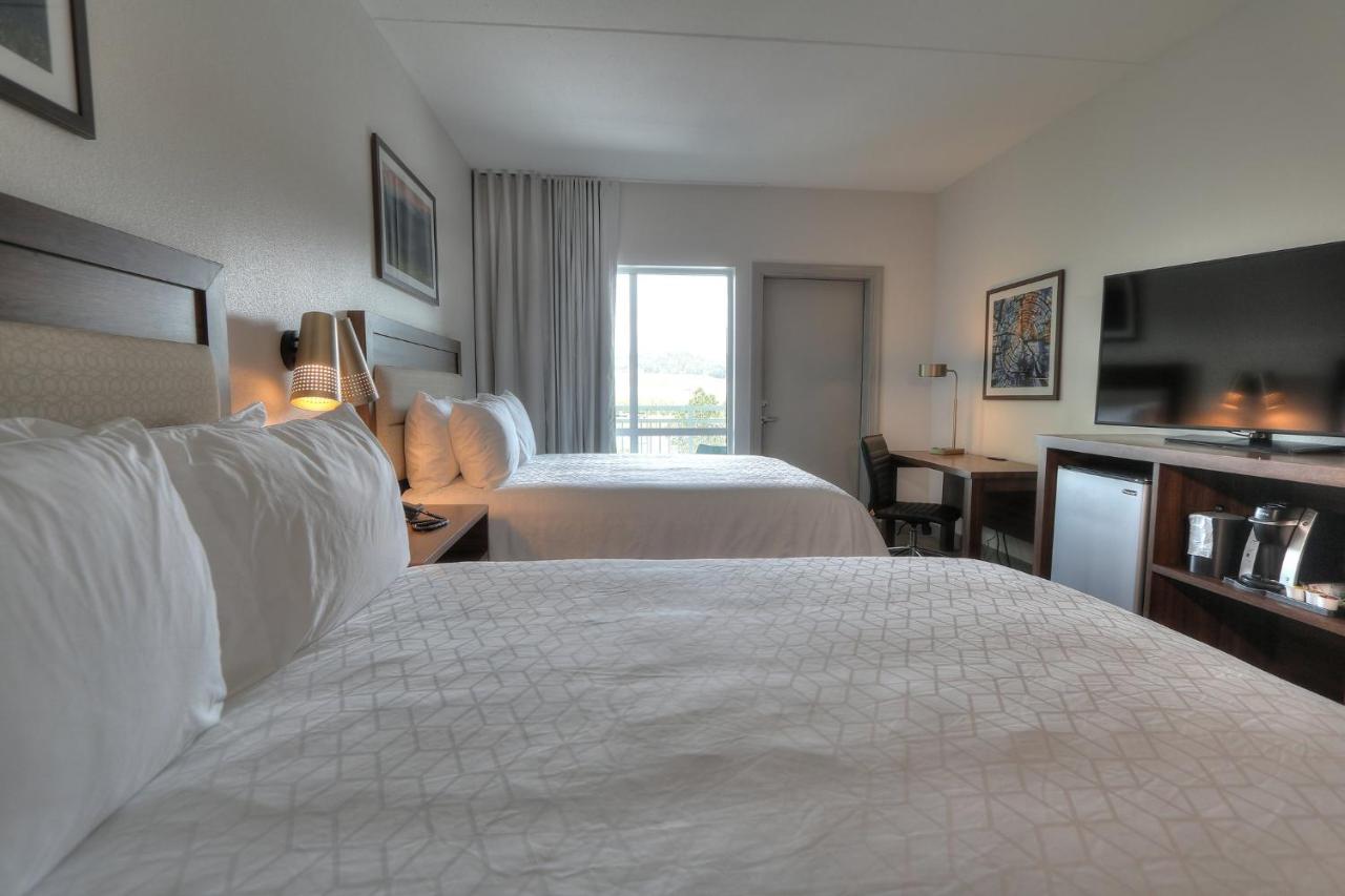 Queen Room with Two Queen Beds River Balcony and High Floor - Non-Smoking at Holiday Inn & Suites Pigeon Forge Convention Center by IHG