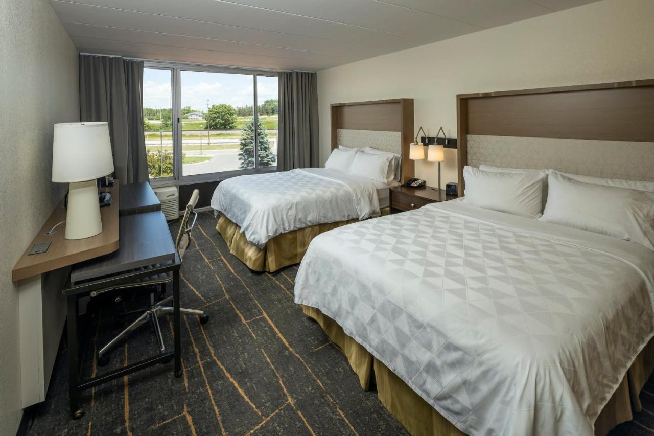 Standard Queen Room with Two Queen Beds and Pool View at Holiday Inn Detroit Lakes - Lakefront by IHG