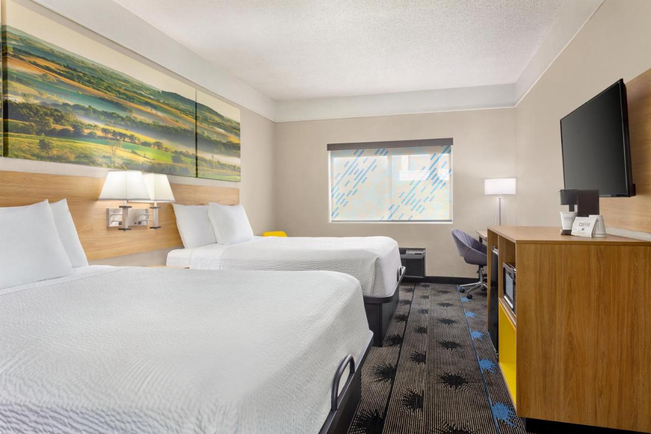 Queen Room with Two Queen Beds - Non-Smoking at Days Inn by Wyndham Kansas City International Airport