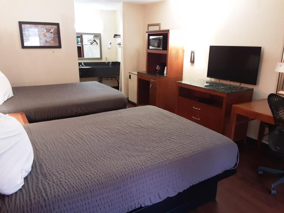 Queen Room with Two Queen Beds - Smoking at Econo Lodge Inn & Suites Griffin North