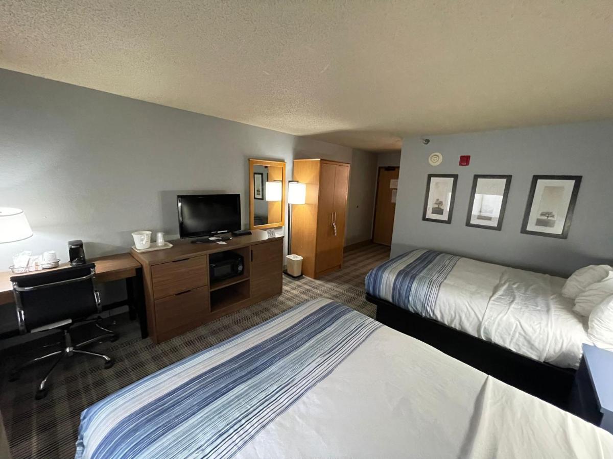 Queen Room with Two Queen Beds - Non-Smoking at AmericInn by Wyndham Sayre