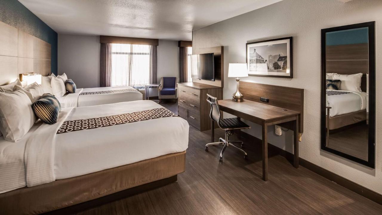 Queen Room with Two Queen Beds and Sofa Bed at Best Western Plus Champaign/Urbana Inn