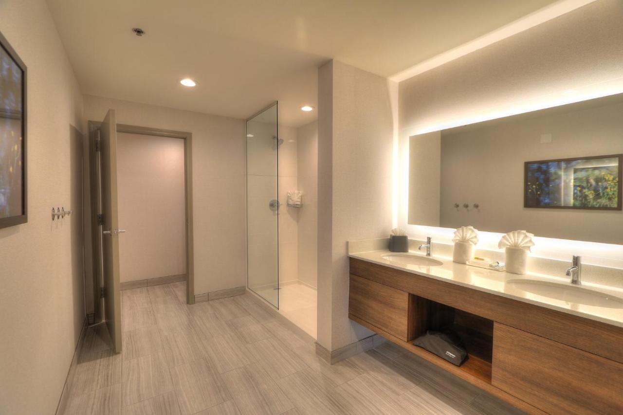 Queen Suite with Two Queen Beds Fireplace and Parkway Balcony at Holiday Inn & Suites Pigeon Forge Convention Center by IHG