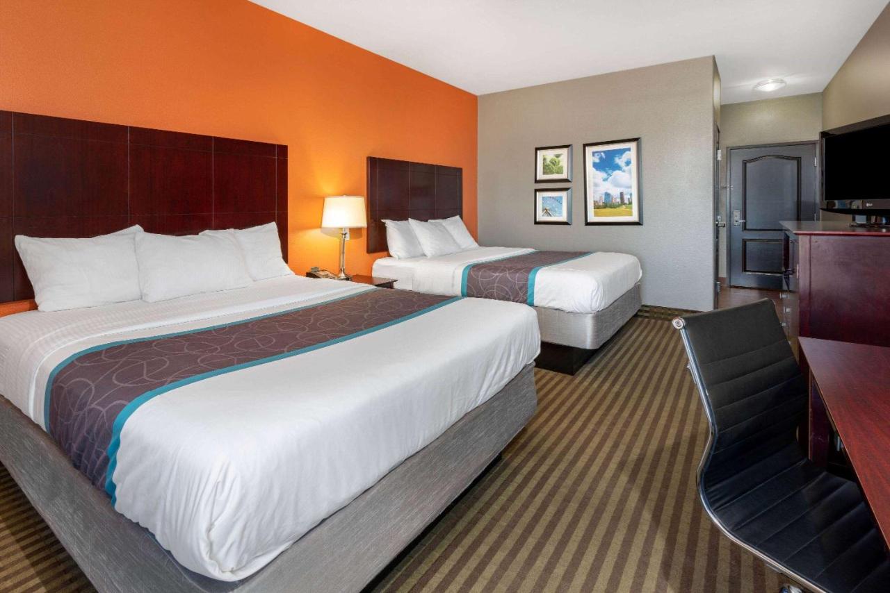 Queen Room with Two Queen Beds and Roll-In Shower - Mobility/Hearing Accessible - Non-Smoking at La Quinta Inn & Suites by Wyndham Houston Bush Intl Airpt E