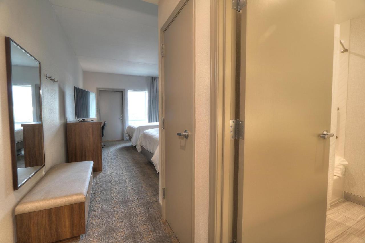 Queen Room with Two Queen Beds and Parkway Balcony - Non-Smoking at Holiday Inn & Suites Pigeon Forge Convention Center by IHG
