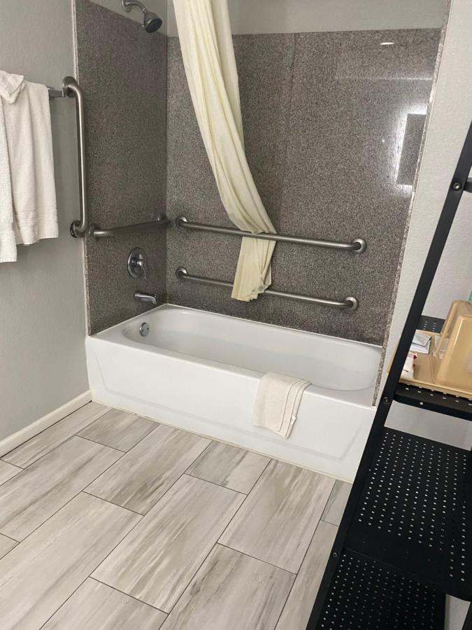 King Room with Mobility Accessible Tub and Sofa Bed at SureStay Hotel by Best Western Spring North Houston