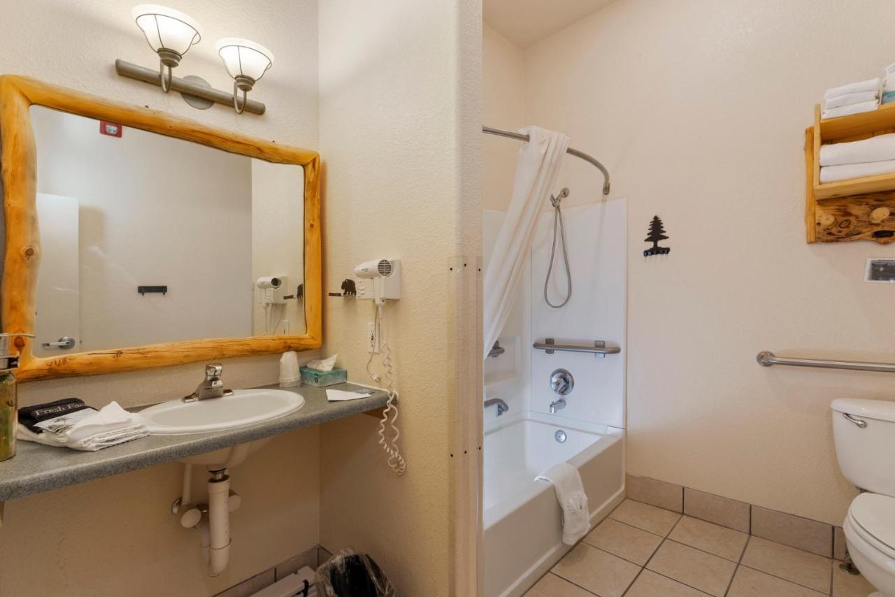 King Bed with Balcony View and Disability Access at Gateway Inn