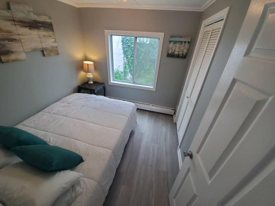  | Beachy Bay Breeze Bungalow 2BR with parking and close to many amenities.