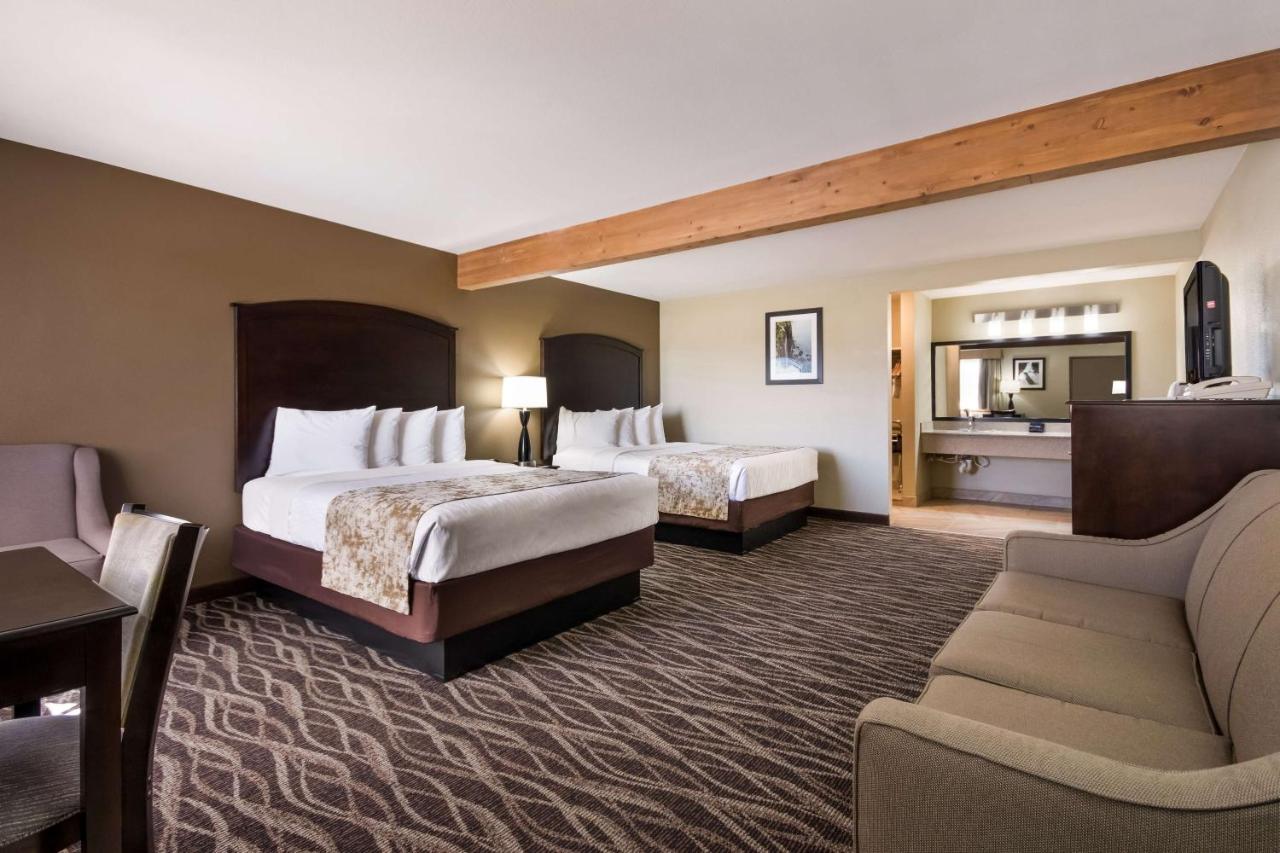 Queen Room with Two Queen Beds and Sofa Bed at Best Western Weston Inn