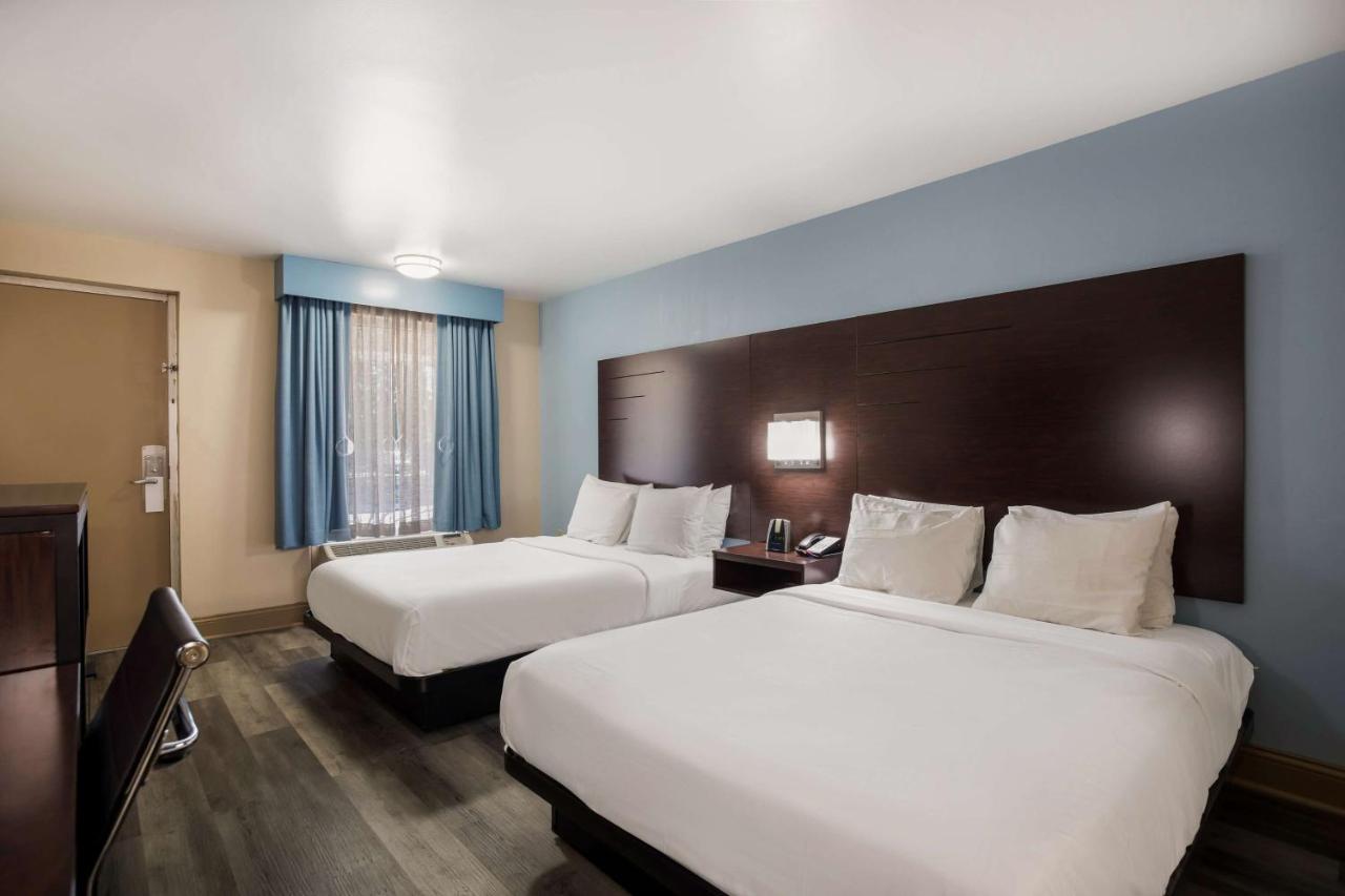 Queen Room with Two Queen Beds and Mobility Accessible Bathtub at SureStay Hotel by Best Western Bardstown General Nelson