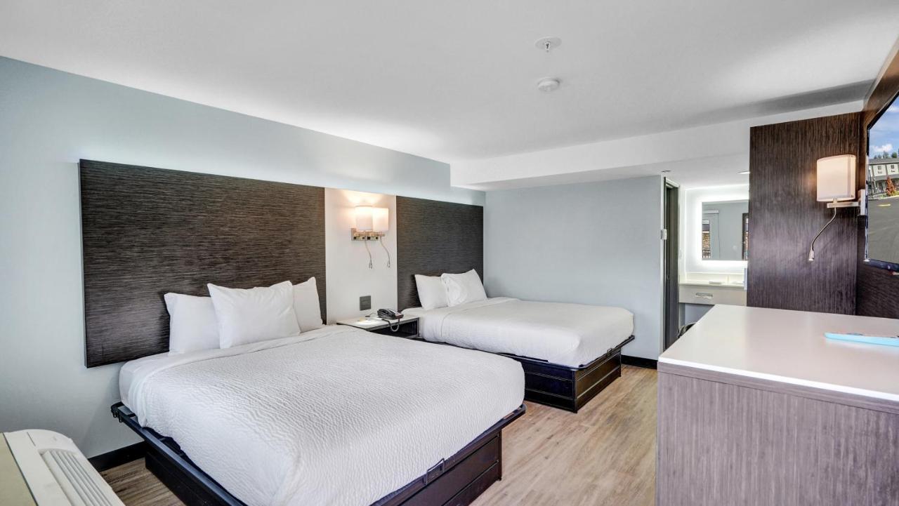 Queen Room with Two Queen Beds - Non-Smoking at Days Inn & Suites by Wyndham Niagara Falls/Buffalo