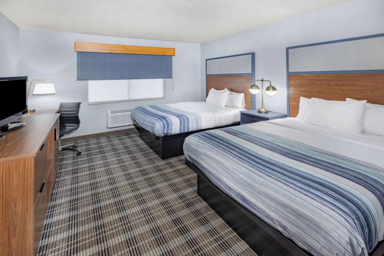 Queen Room with Two Queen Beds - Non-Smoking at AmericInn by Wyndham Sayre