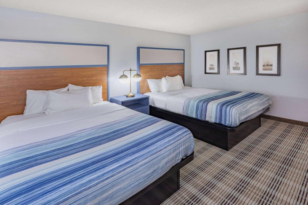 Queen Room with Two Queen Beds - Non-Smoking at AmericInn by Wyndham Sayre