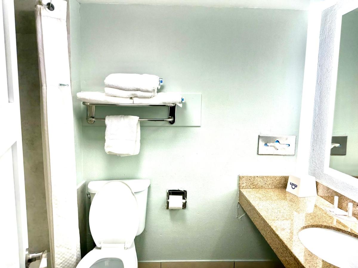 Room with One King and Two Double Beds - Non-Smoking at Days Inn by Wyndham Pensacola - Historic Downtown