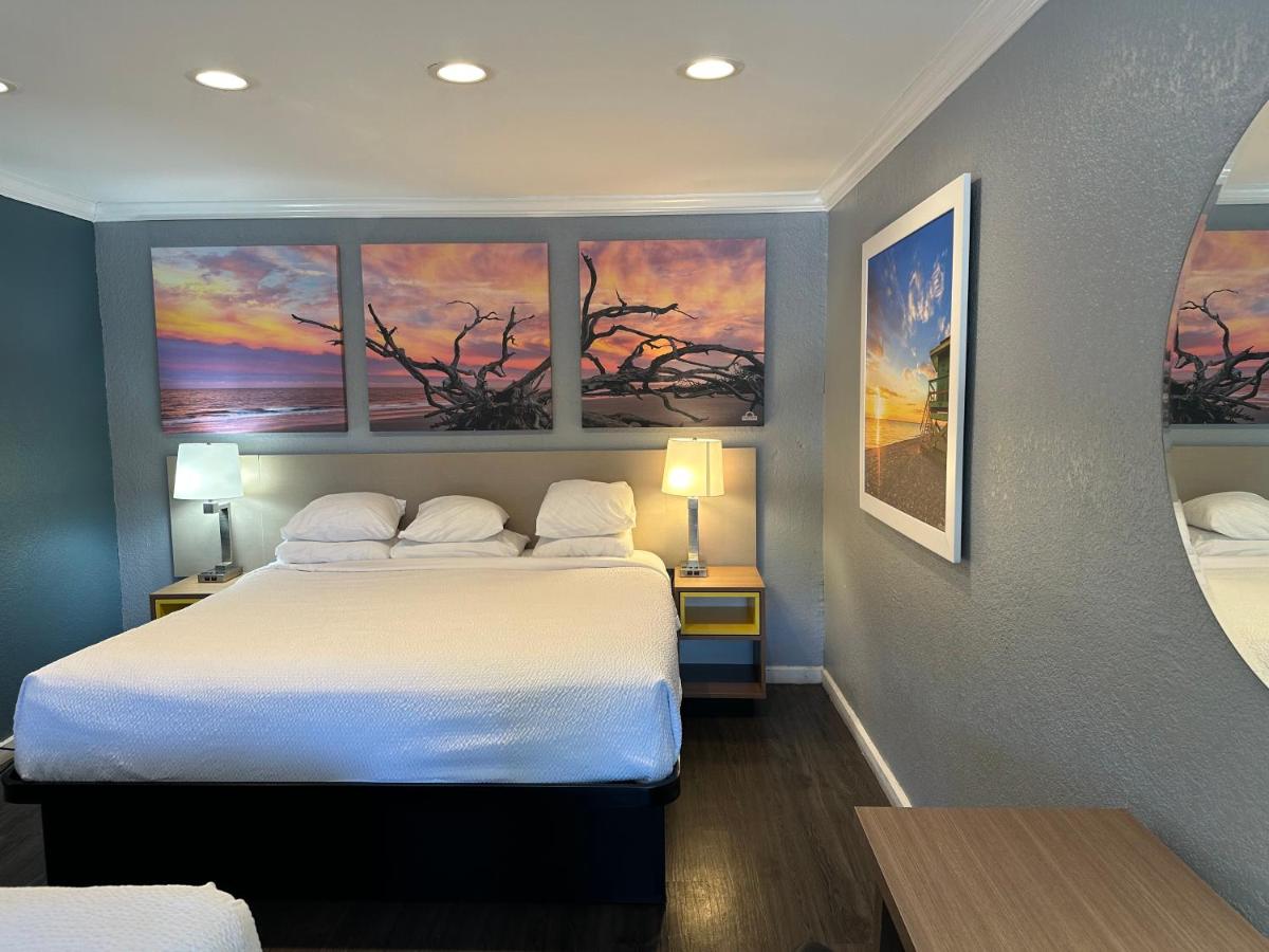 Room with One King and Two Double Beds - Non-Smoking at Days Inn by Wyndham Pensacola - Historic Downtown