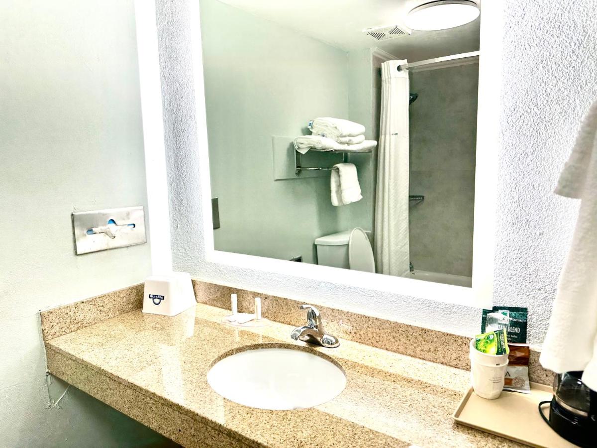 Room with One King and Two Double Beds - Non-Smoking at Days Inn by Wyndham Pensacola - Historic Downtown