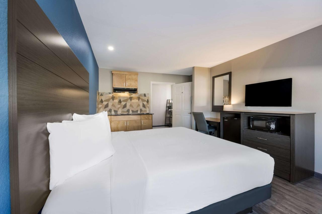 King Room with Roll-In Shower - Disability Access at SureStay Hotel by Best Western Spring North Houston