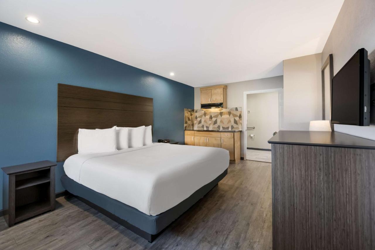 King Room with Roll-In Shower - Disability Access at SureStay Hotel by Best Western Spring North Houston