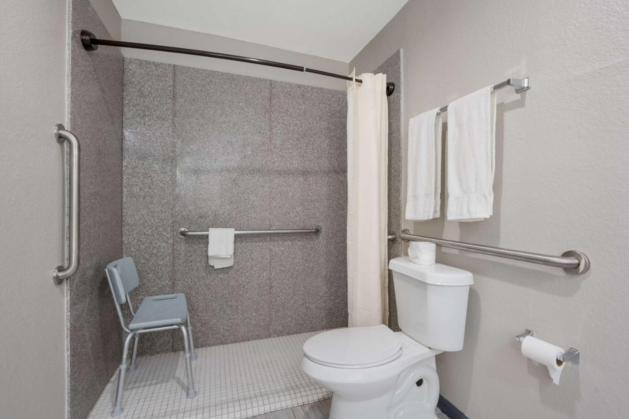 King Room with Roll-In Shower - Disability Access at SureStay Hotel by Best Western Spring North Houston