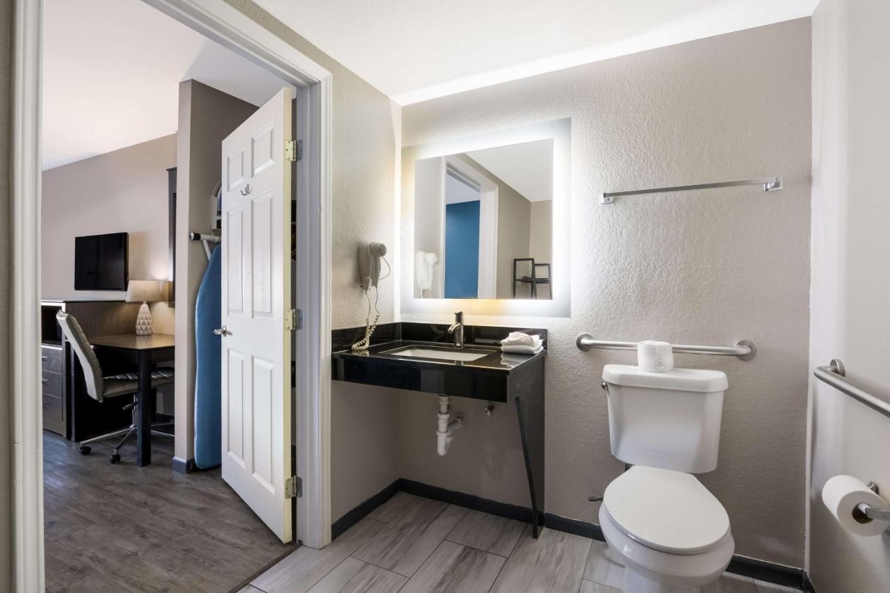 King Room with Mobility Accessible Tub and Sofa Bed at SureStay Hotel by Best Western Spring North Houston