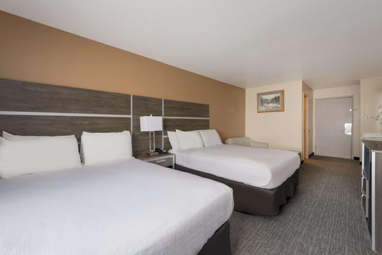 Queen Room with Two Queen Beds and Sofa Bed - Non-Smoking at SureStay Hotel by Best Western Wells