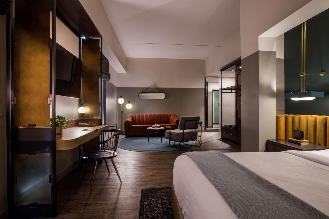 One-Bedroom Corner King Suite with Sofa Bed at Cyrus Hotel, Topeka, a Tribute Portfolio Hotel