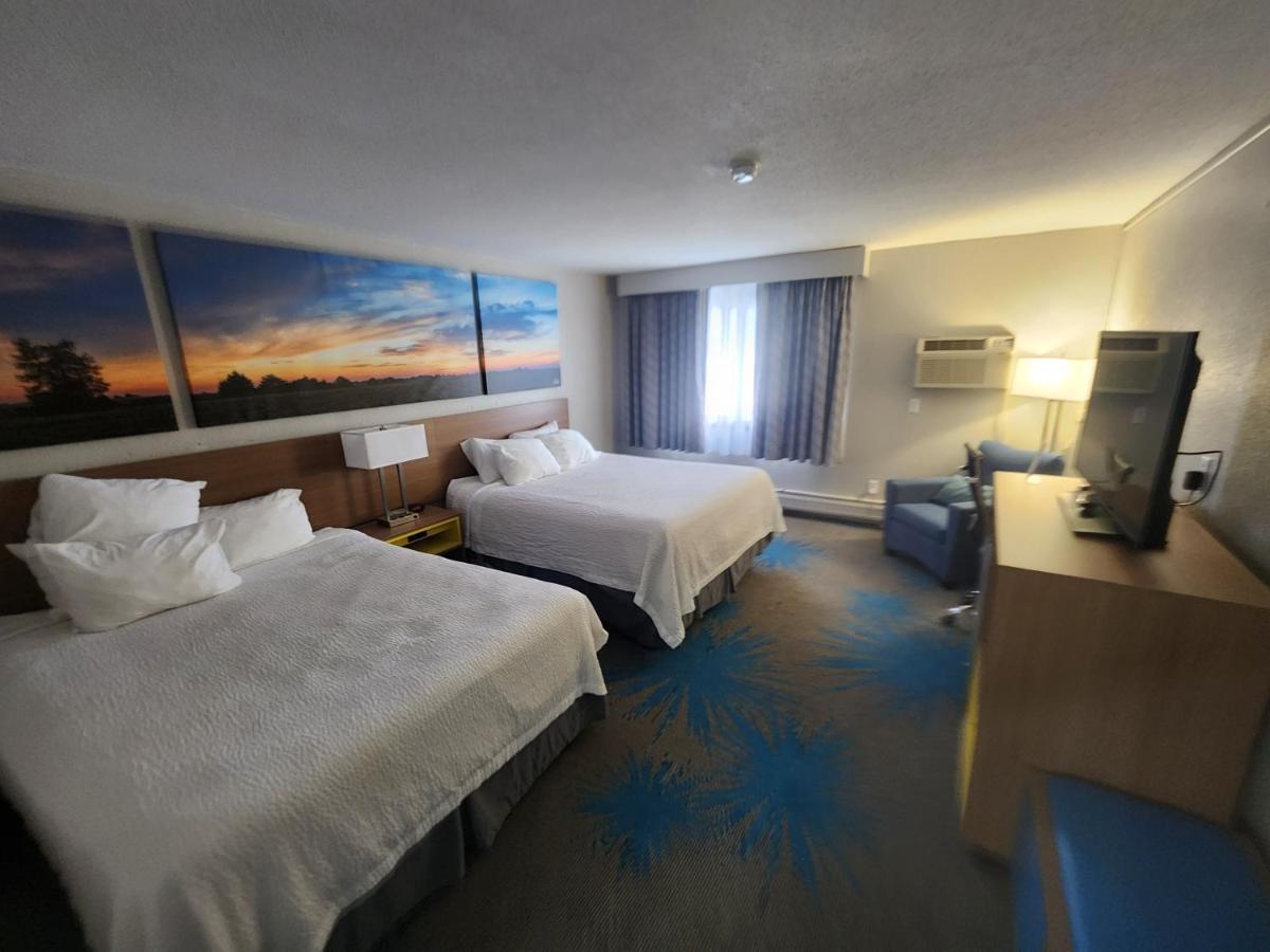 Queen Room with Two Queen Beds - Non-Smoking at Days Inn by Wyndham Sioux Falls Airport