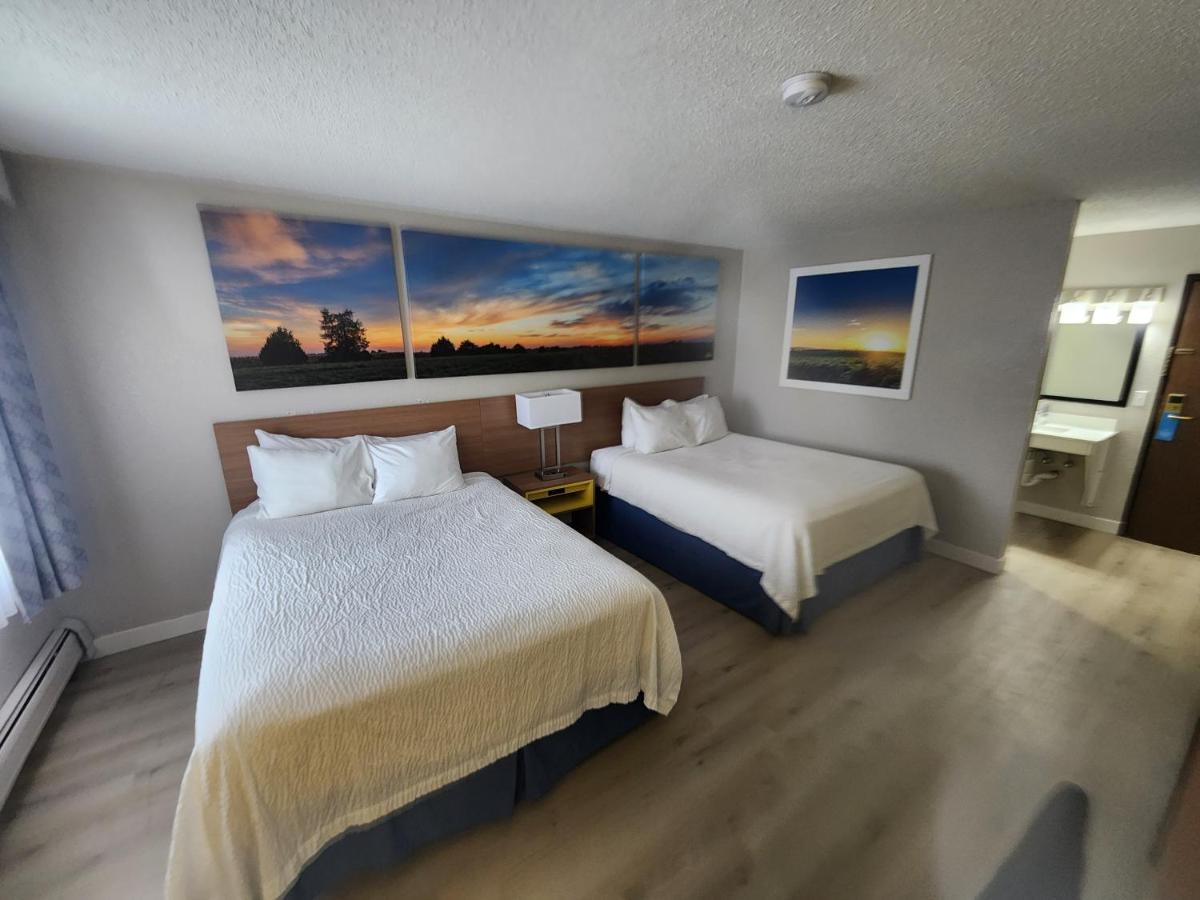 Queen Room with Two Queen Beds - Non-Smoking at Days Inn by Wyndham Sioux Falls Airport