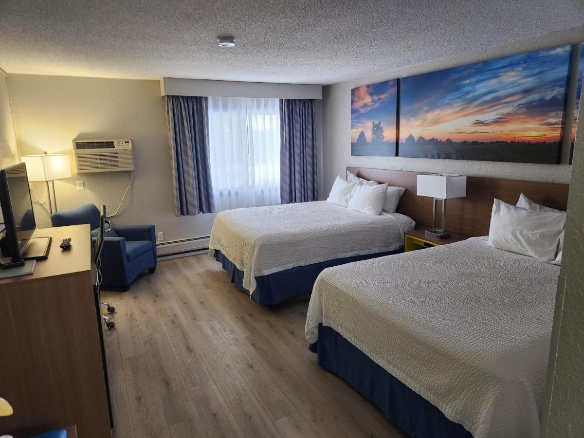 Queen Room with Two Queen Beds - Non-Smoking at Days Inn by Wyndham Sioux Falls Airport