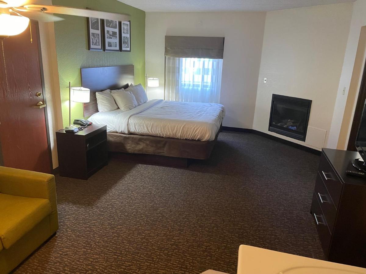King Suite with Fireplace - Non-Smoking at Sleep Inn & Suites near Sports World Blvd