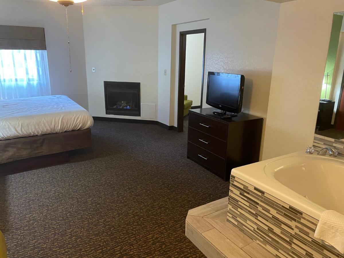 King Suite with Fireplace - Non-Smoking at Sleep Inn & Suites near Sports World Blvd