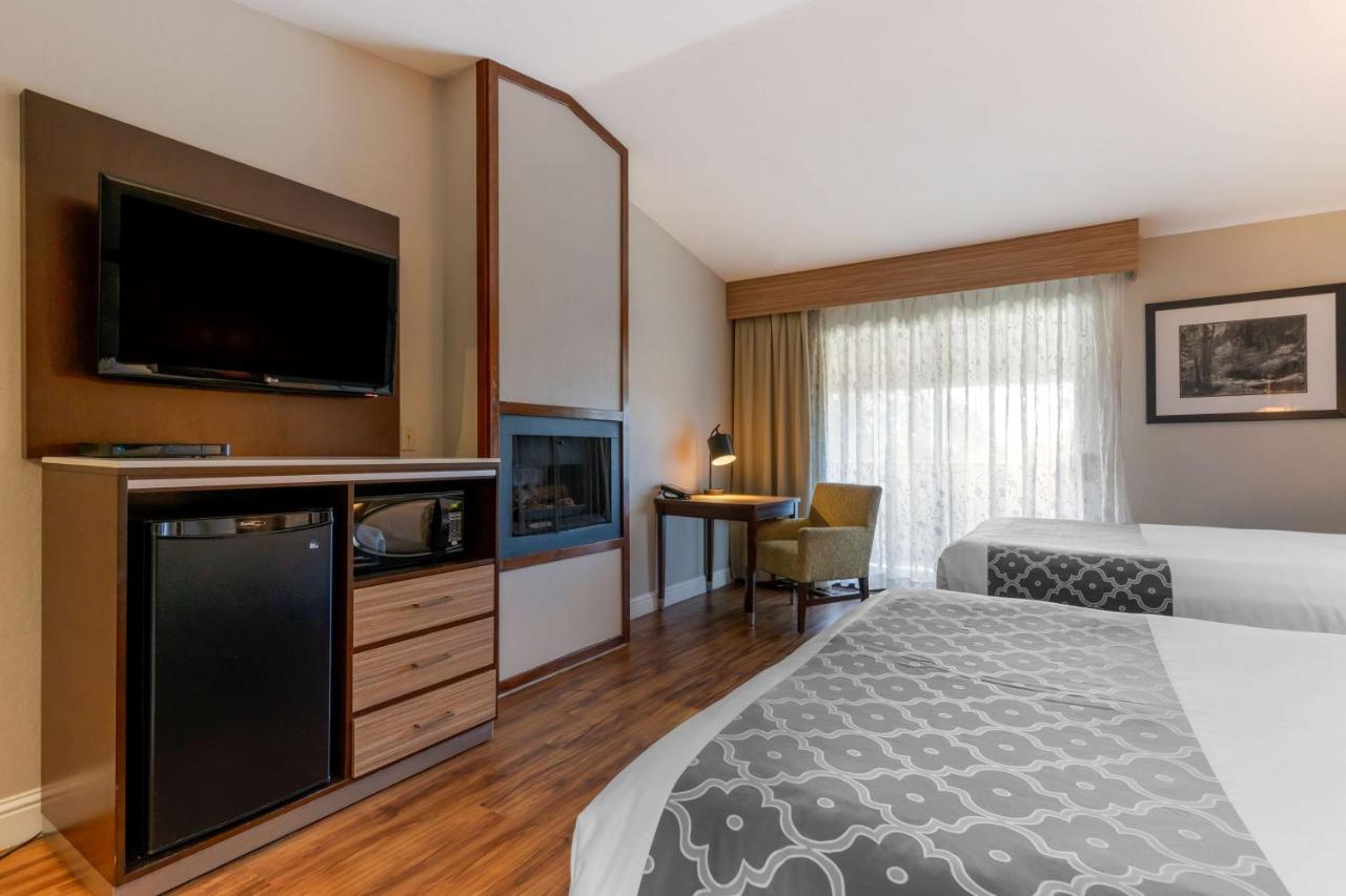 Queen Room with Two Queen Beds and Fireplace at Best Western Plus Forest Park Inn