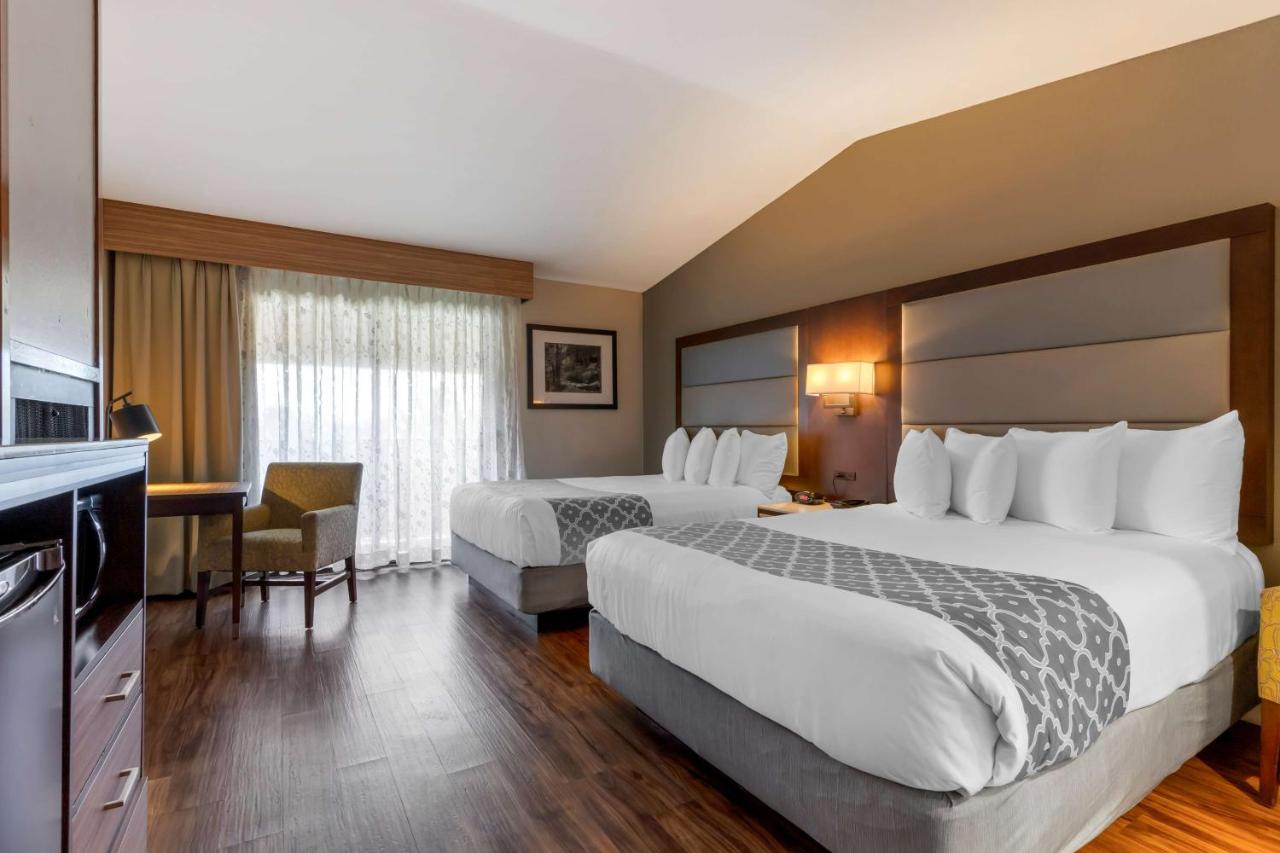 Queen Room with Two Queen Beds and Fireplace at Best Western Plus Forest Park Inn