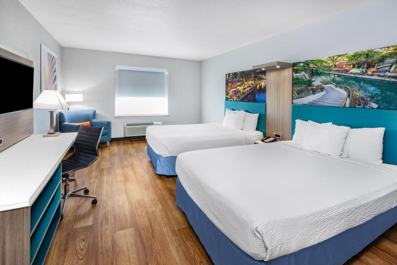 Queen Room with Two Queen Beds - Non-Smoking at Days Inn & Suites by Wyndham San Antonio near Frost Bank Center